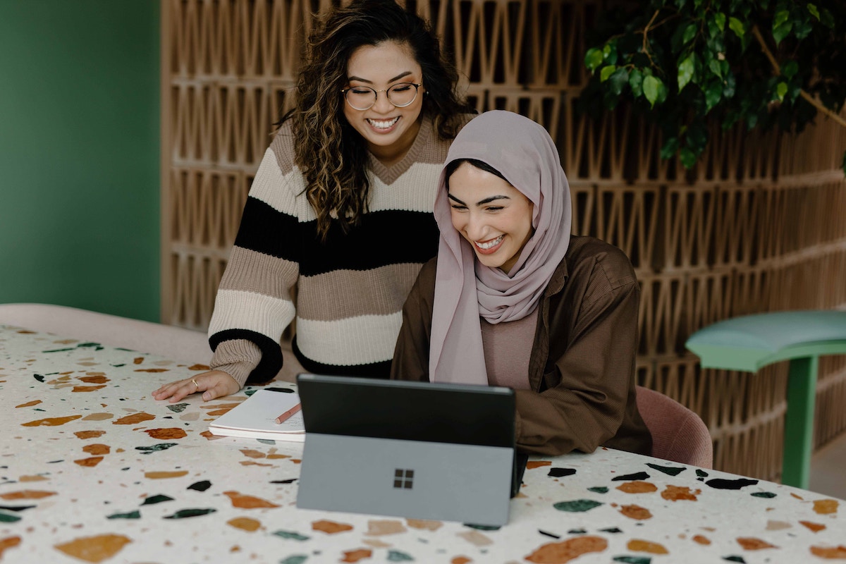 Two Diverse Women in the Workplace Smiling